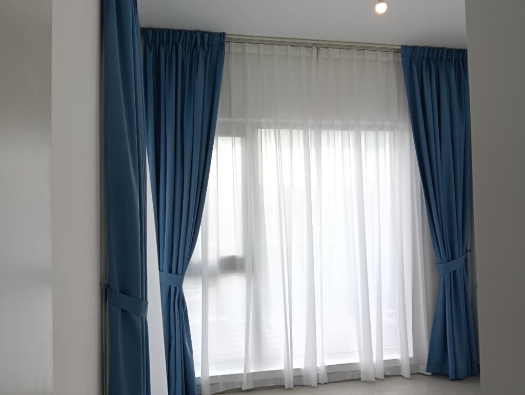 Curtain Crew Dxw technician installing curtain track in a Dubai apartment